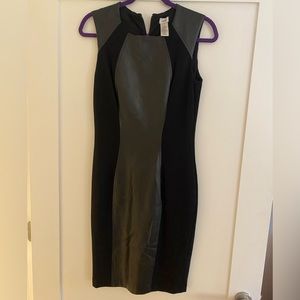 Figure flattering faux leather sheath dress. Fits like a glove, so comfortable!